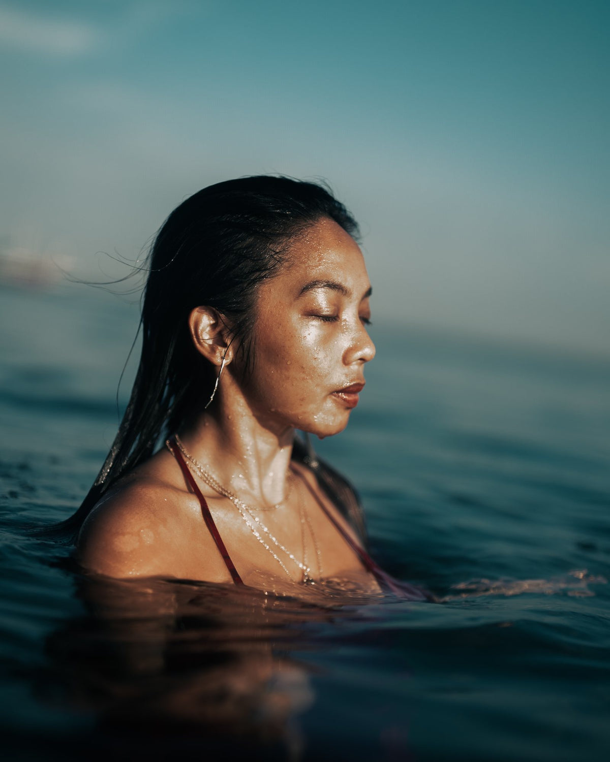 Portrait of Kaye Timonera, founder of Sparkling Mermaid, in the sea