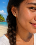 Sparkle Star Stud Earrings worn with a braid on the beach