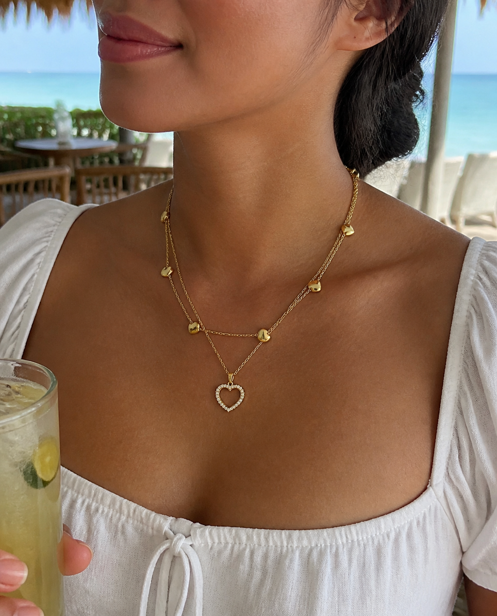 Layered Heart Necklace worn at a beach cafe