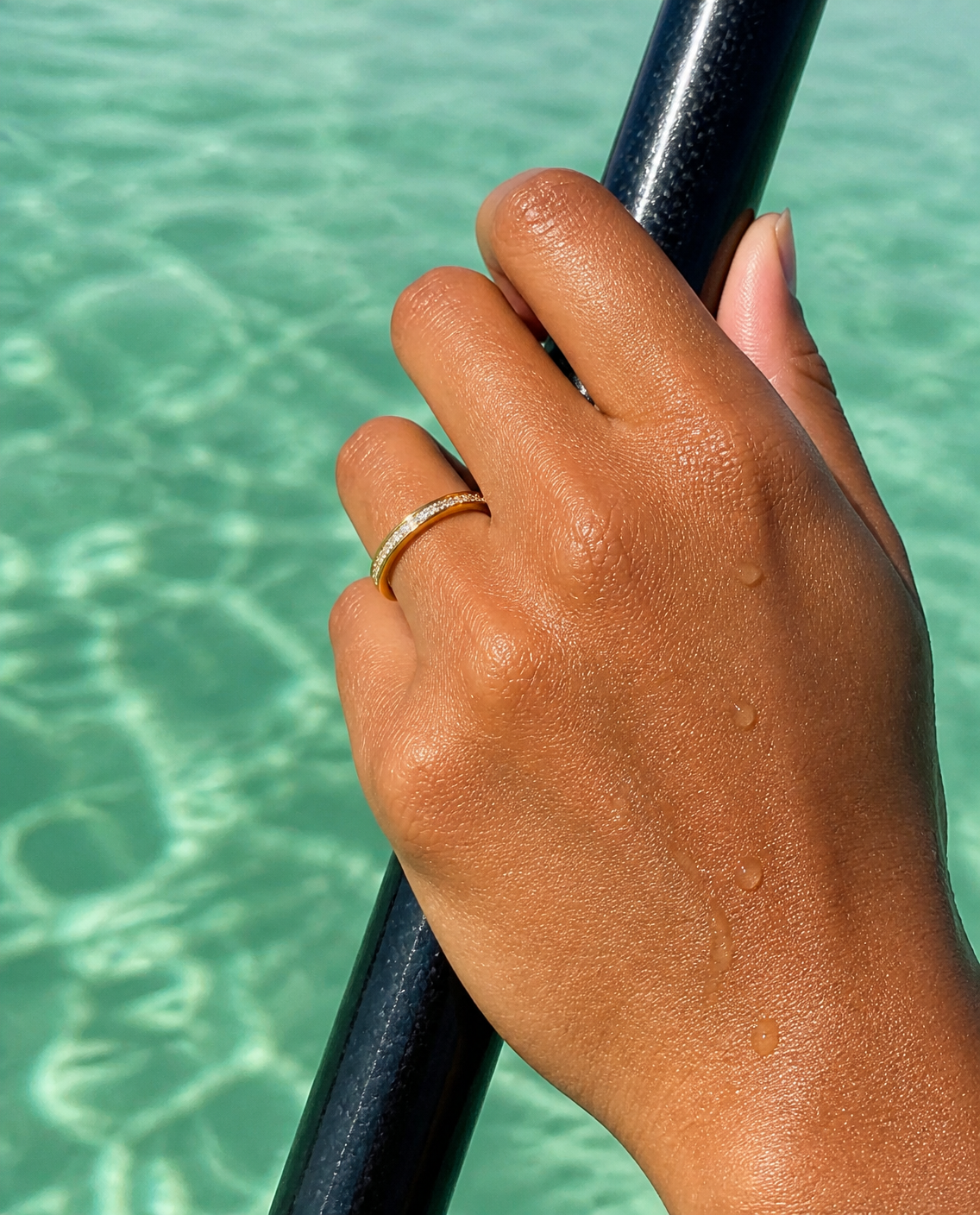 Pave Band Ring worn holding a paddle