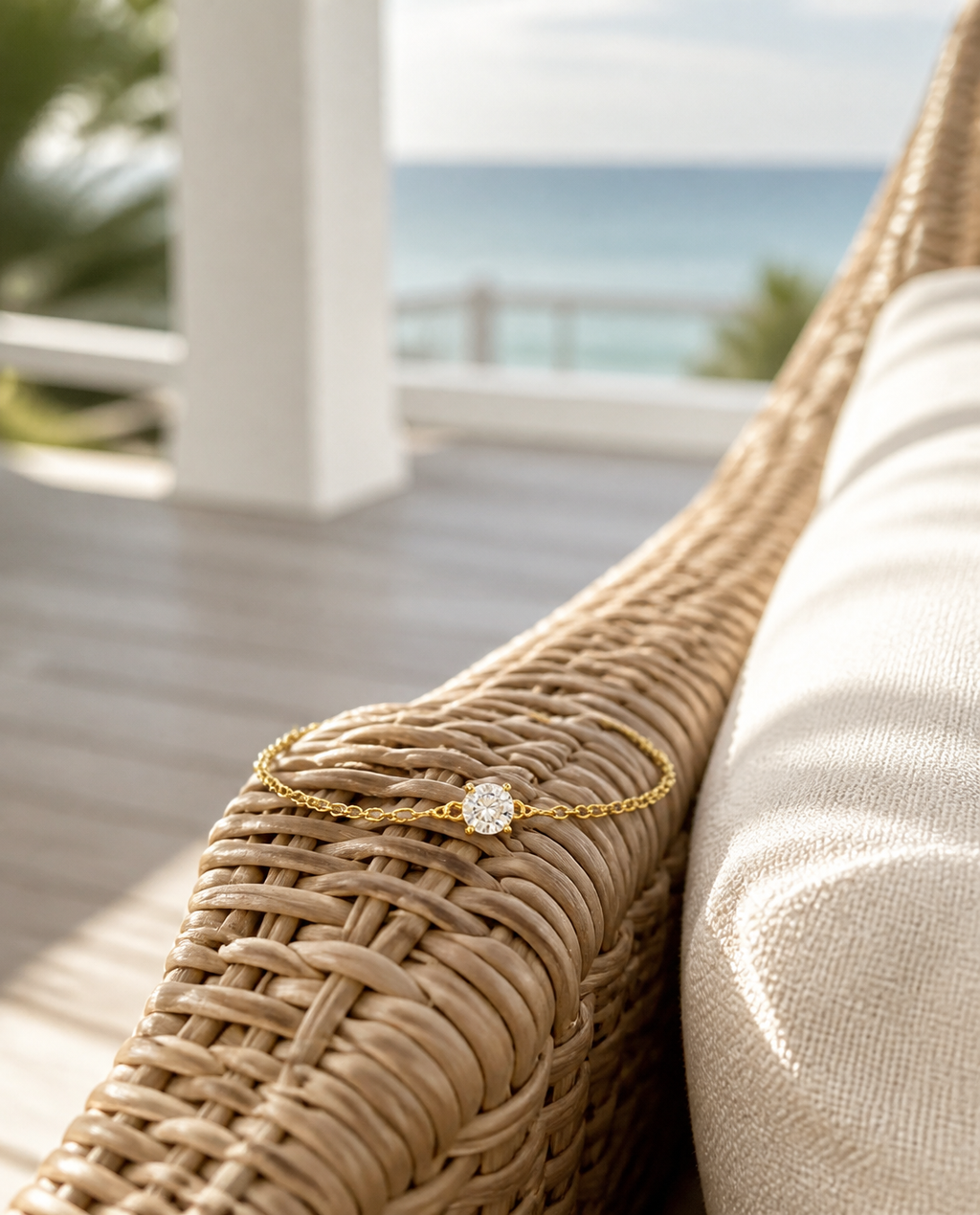 Solitaire Chain Bracelet on a rattan chair
