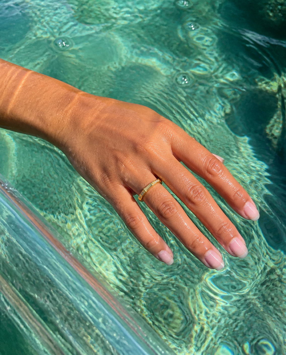 Dainty Sparkle Band Ring worn trailing fingers from a kayak