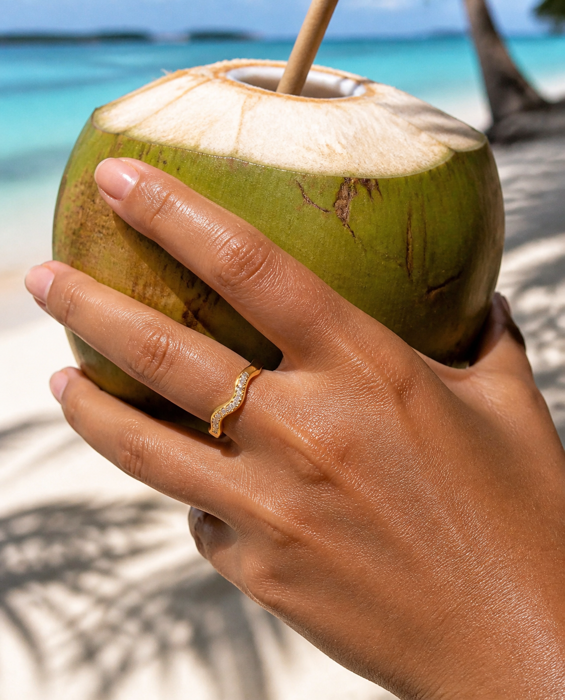 Textured Band Ring worn while holding a young coconut