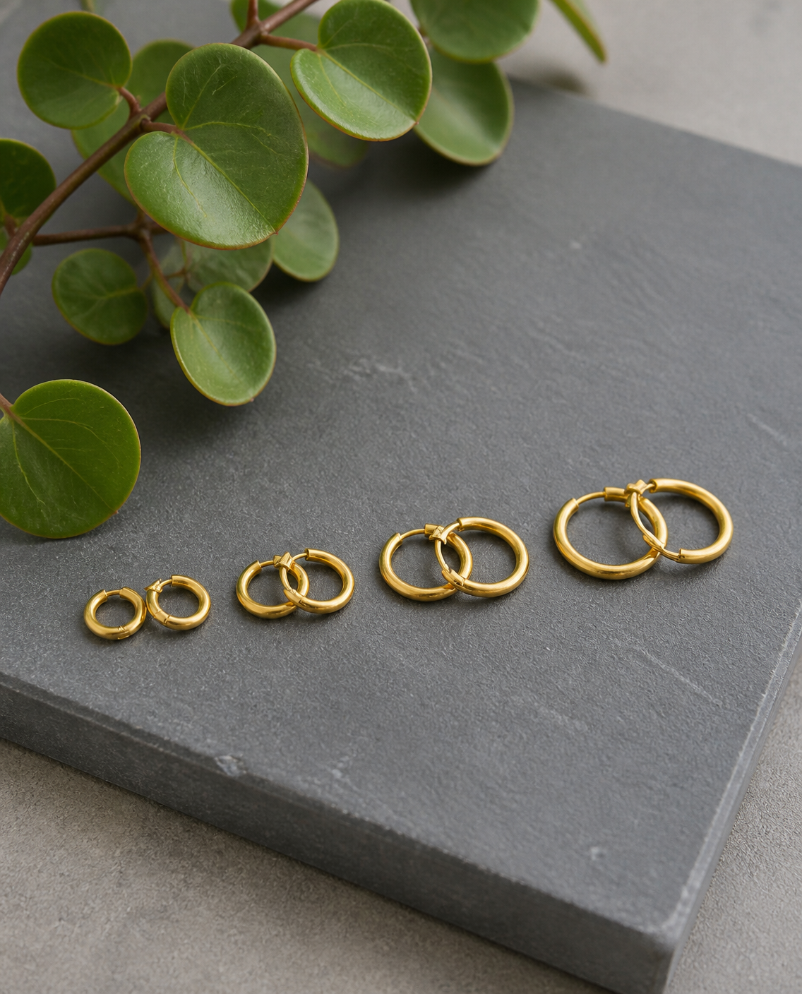 Classic Huggie Hoops size range on slate