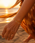 Dangling Charm Bracelet worn dancing at sunset