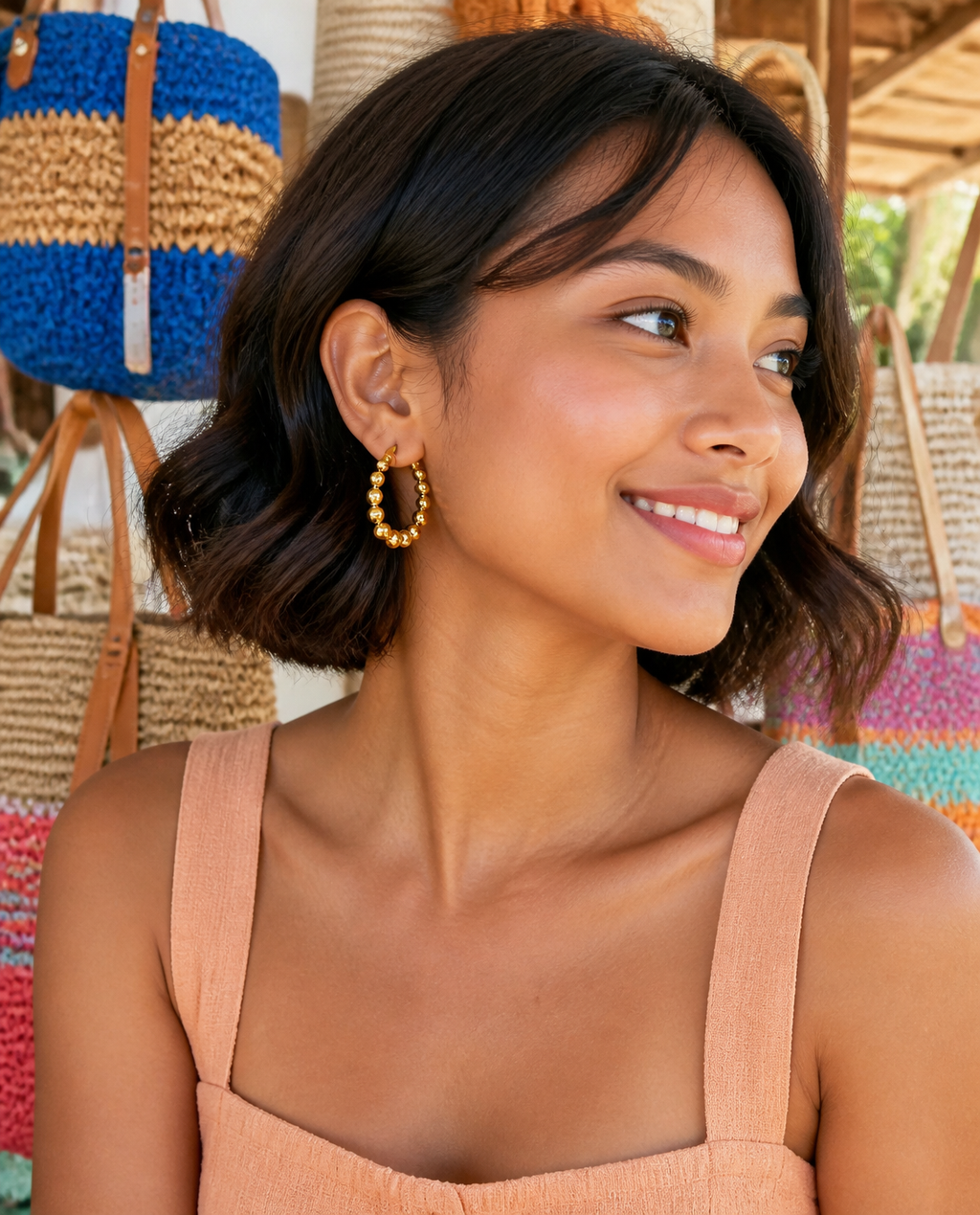 Beaded Bubble Hoops worn at a beach market