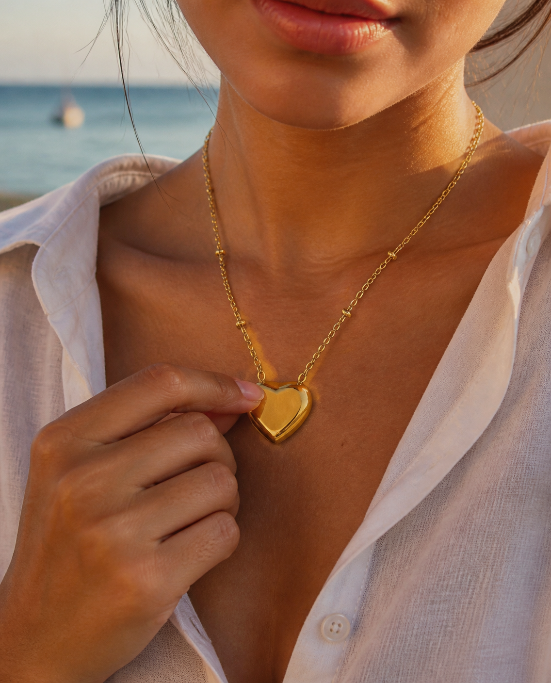 Puffy Heart Necklace close-up worn with a linen shirt